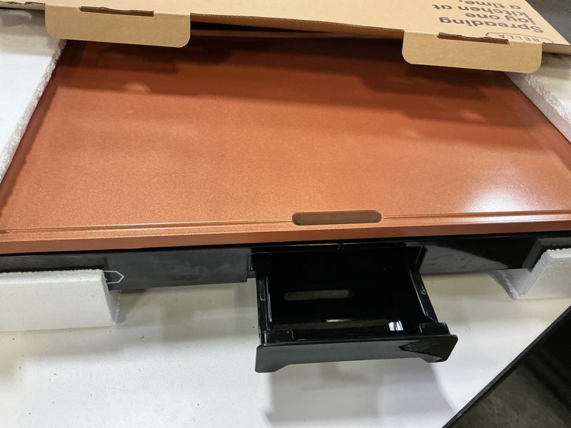 Condition photo showing As Is for BELLA XL Electric Ceramic Titanium Griddle, Make 15 Eggs At Once, Healthy-Eco Non-stick Coating, Hassle-Free Clean Up, Large Submersible Cooking Surface, 12" x 22", Copper/Black 12" x 22" Copper