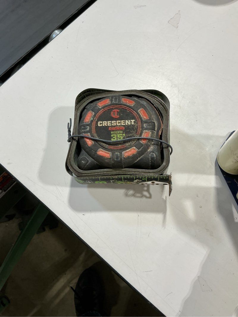 Condition photo showing As Is for crescent lufkin orange shockforce nite eye 35-ft magnetic tape measure
