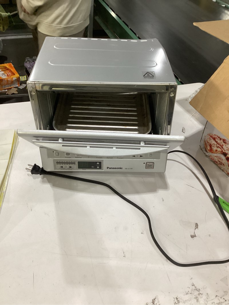Condition photo showing As Is for Panasonic FlashXpress Toaster Oven Countertop, 4-Slice Small Toaster Oven Compact Size with Double Infrared Heating, 6 Auto Cook Options and Precise Temperature Control, 1300W - NB-G110P (Silver) FlashXpress Compact Matte Silver