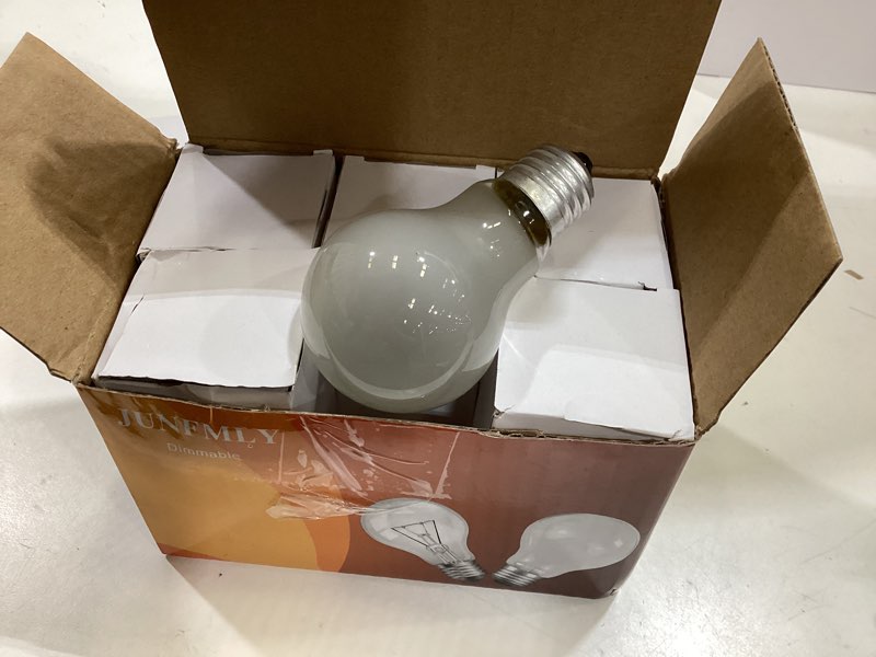 Condition photo showing As Is for 75 watt incandescent light bulbs, a19 frosted incandescent rough service light bulb, e26 medium base 110-130v,2700k soft warm white, (6 pack)