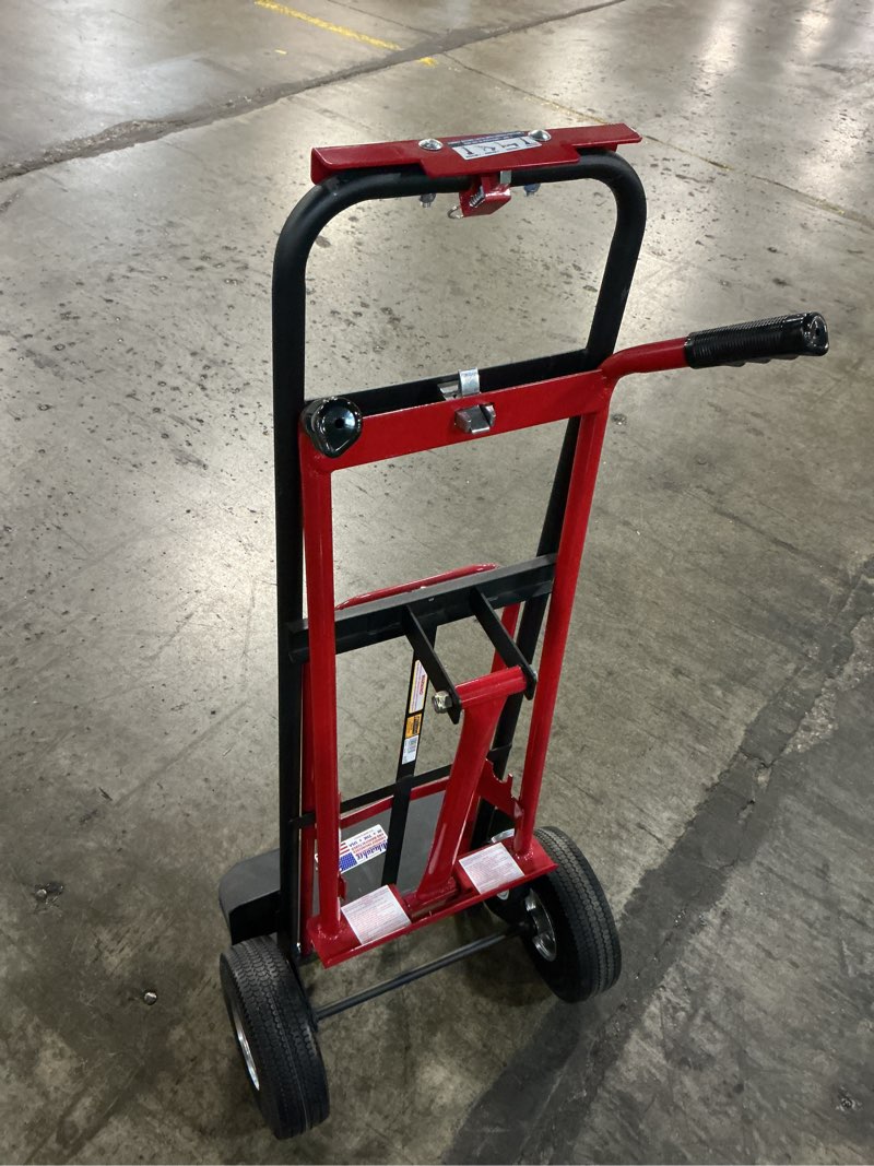 Condition photo showing As Is for quick-change 4 in 1 truck with 10? flat free tires