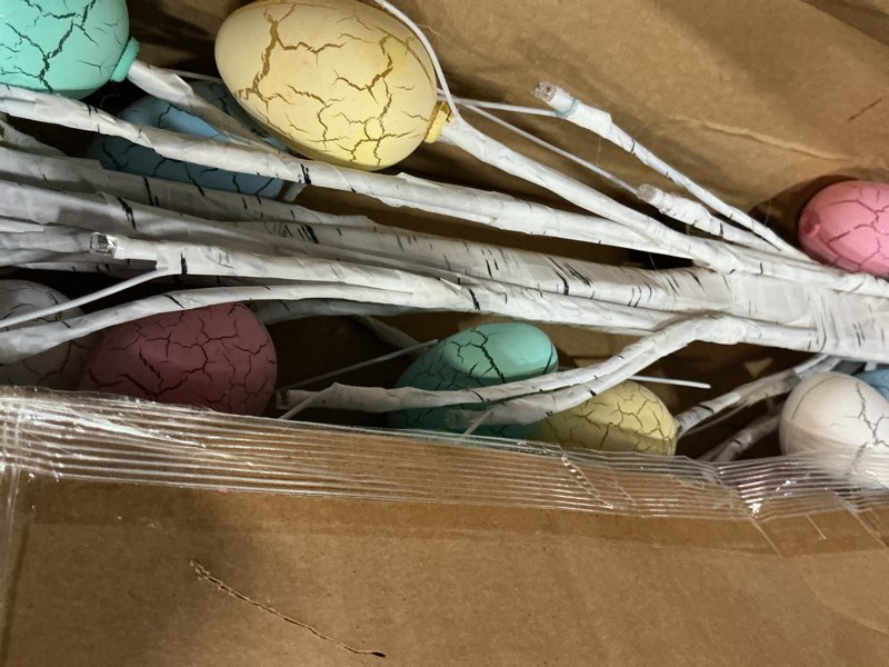 Condition photo showing As Is for nearly natural 4ft. pre-lit artificial easter twig tree with 48 egg shaped led ornaments