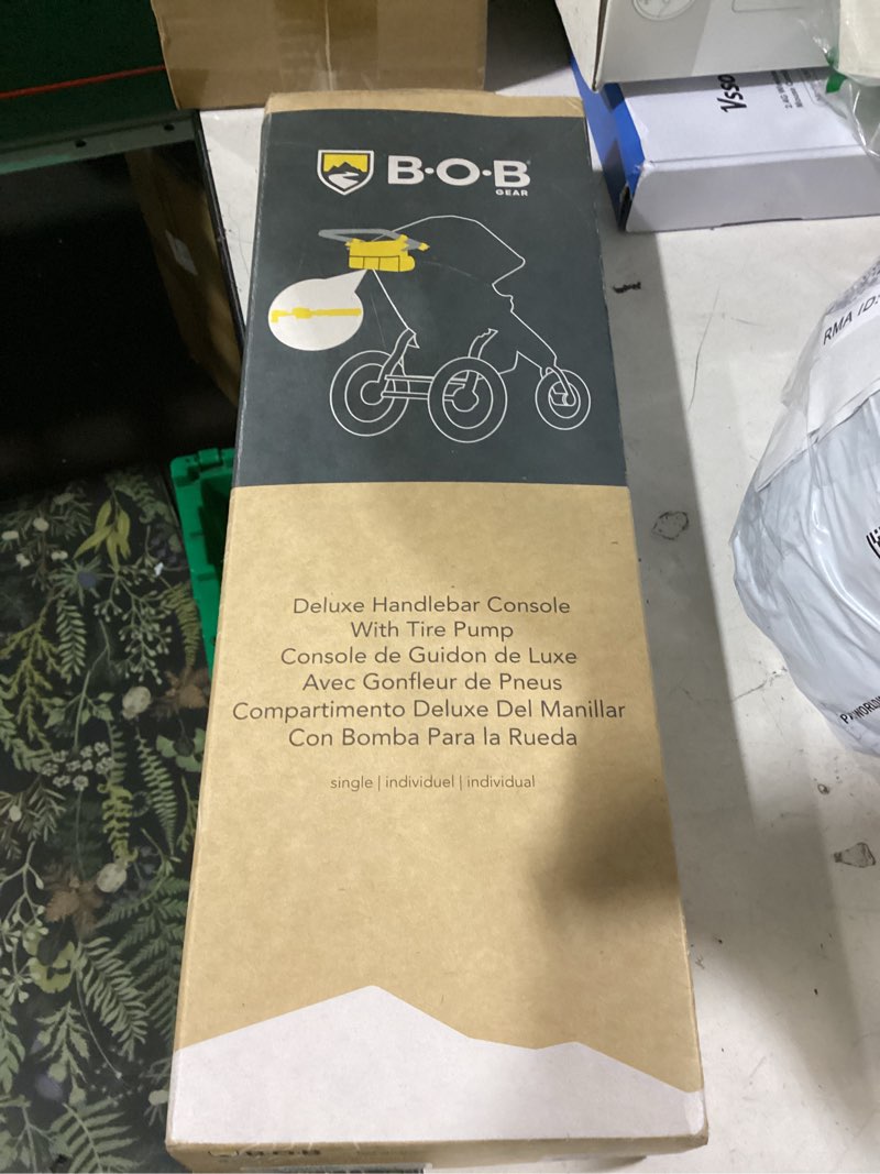 Condition photo showing New/Like New for bob gear deluxe handlebar console with tire pump for single jogging strollers, black 2 piece set deluxe single