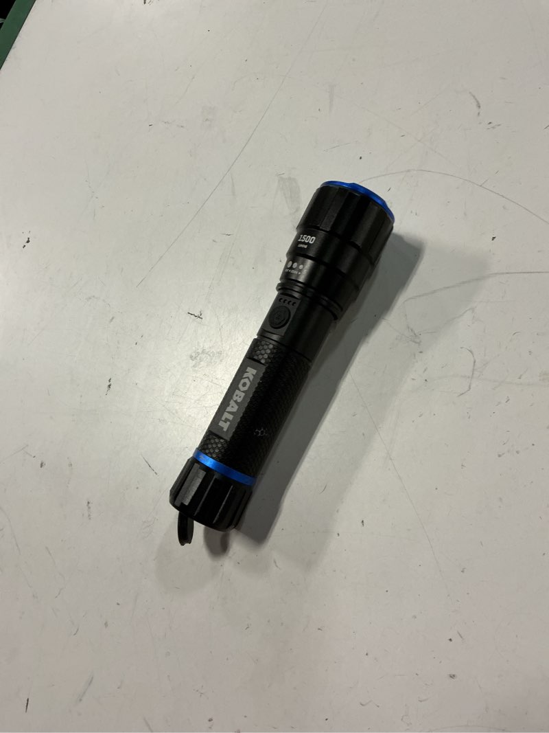 Condition photo showing As Is for kobalt 1500-lumen 4 -adjustable mode led rechargeable flashlight