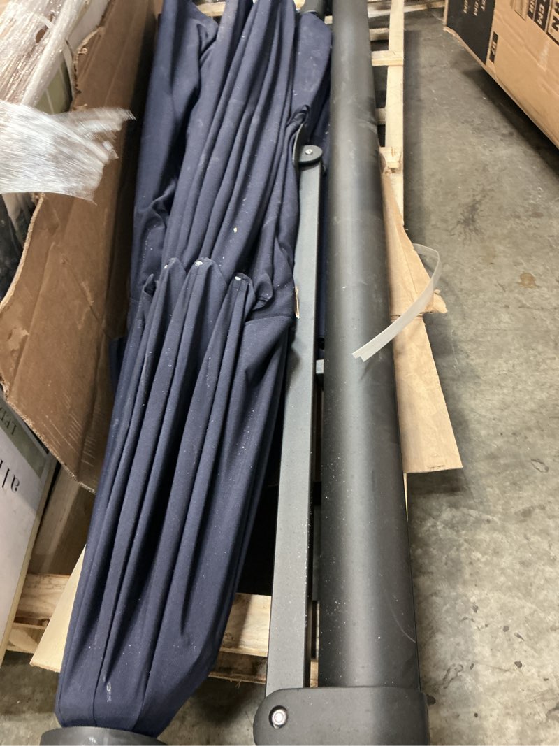 Condition photo showing As Is for 11 ft. octagon led aluminum cantilever patio umbrella, foot-controlled 360° rotation with a base in black