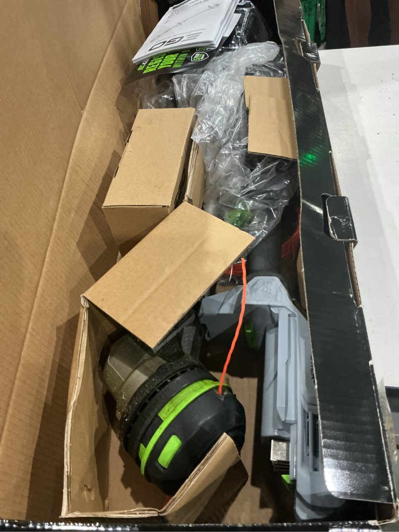 Condition photo showing As Is for ego power+ powerload st1511t 15 in. 56 v battery string trimmer kit (battery & charger) w/ telescopic shaft & 2.5 ah battery