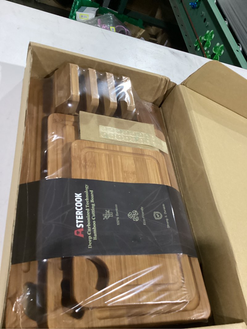 Condition photo showing New/Like New for astercook deep-carbonized bamboo cutting boards for kitchen with wood storage stand, reversible charcuterie & chopping boards with juice grooves and easy-grip handles, knife-friendly, kitchen gift