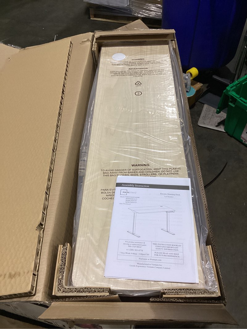 Condition photo showing New/Like New for mainstays electric standing desk