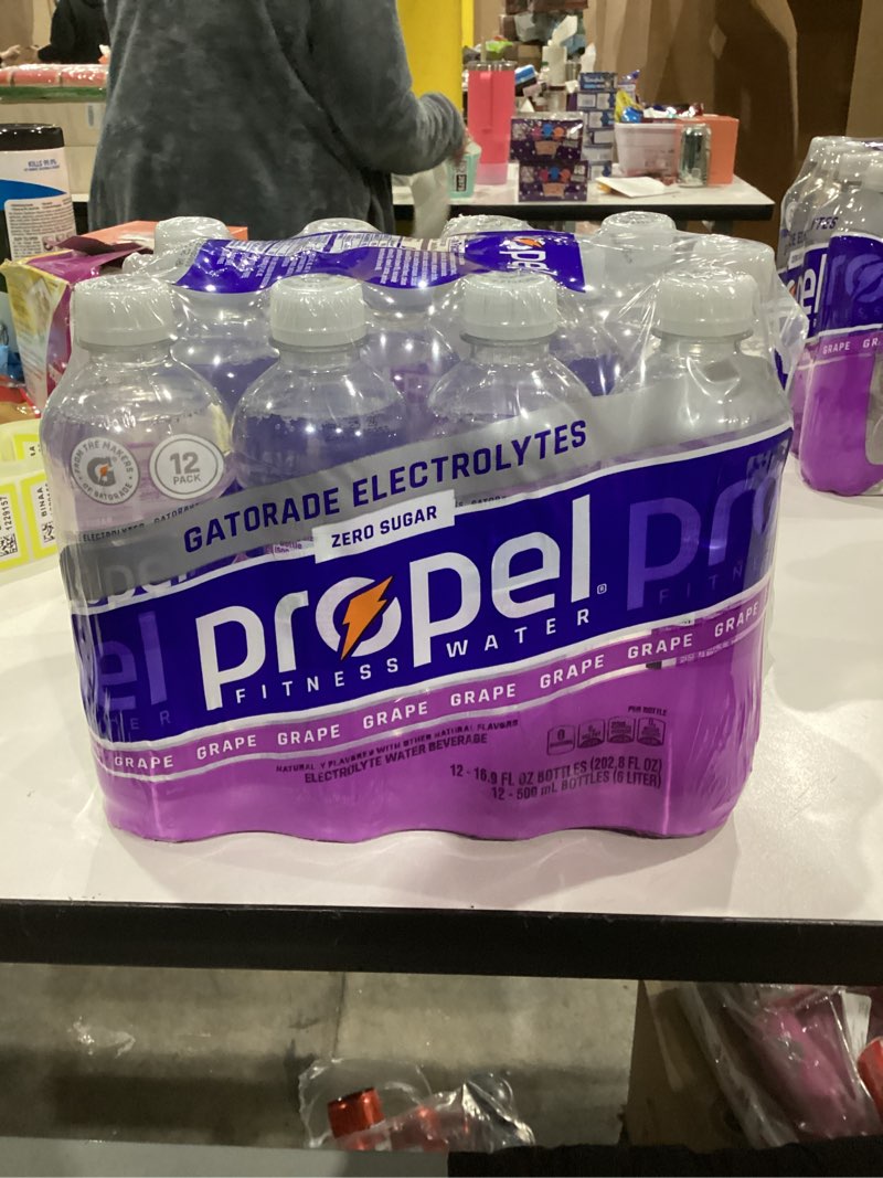 Condition photo showing As Is for Propel, Grape, Zero Calorie Sports Drinking Water with Electrolytes and Vitamins C&E, 16.9 Fl Oz (Pack of 12)