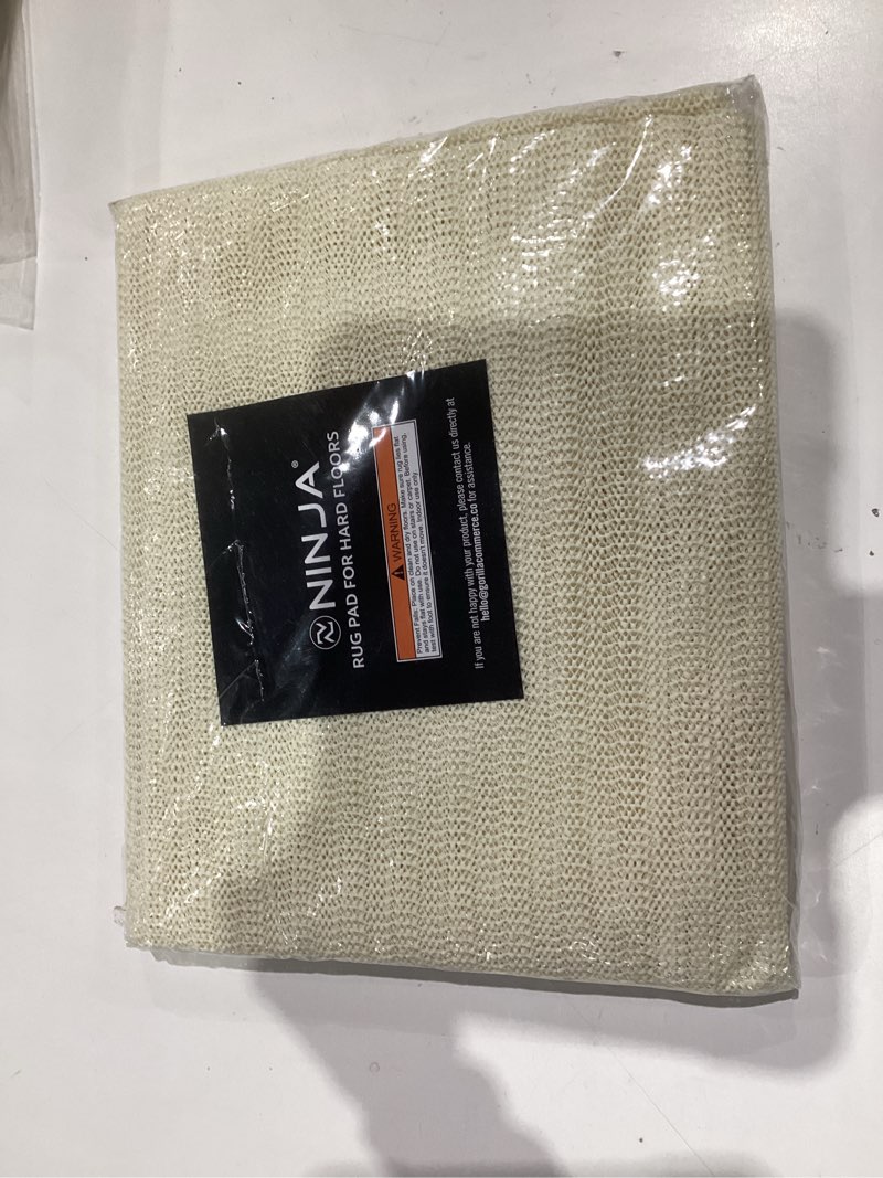 Condition photo showing New/Like New for Ninja Rug Gripper Pad for Hardwood Floors, 2x10 FT, Slip Resistant Grip Pads for Hard Surfaces, Adds Cushion Under Carpet and Maximum Protection, Keeps Area Rugs and Carpets Safe and in Place on Floor 2' x 10' (Rectangular) Traditional Pads for Hard Floors