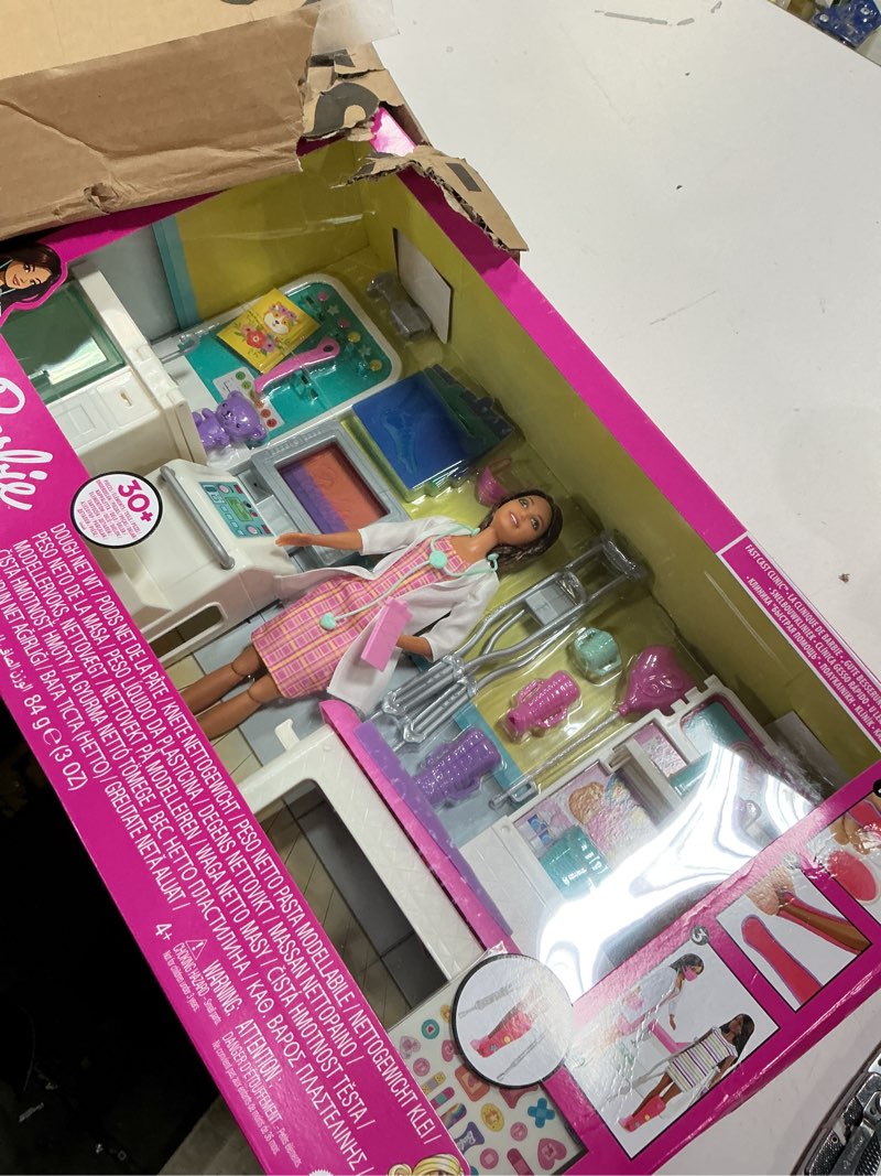 Condition photo showing New/Like New for Barbie Fast Cast Clinic Playset, Brunette Barbie Doctor Doll, 30+ Play Pieces, 4 Play Areas, Cast & Bandage Making, Medical & X-ray Stations, Exam Table, Gift Shop & More, Great Toy for 3 Years & Up
