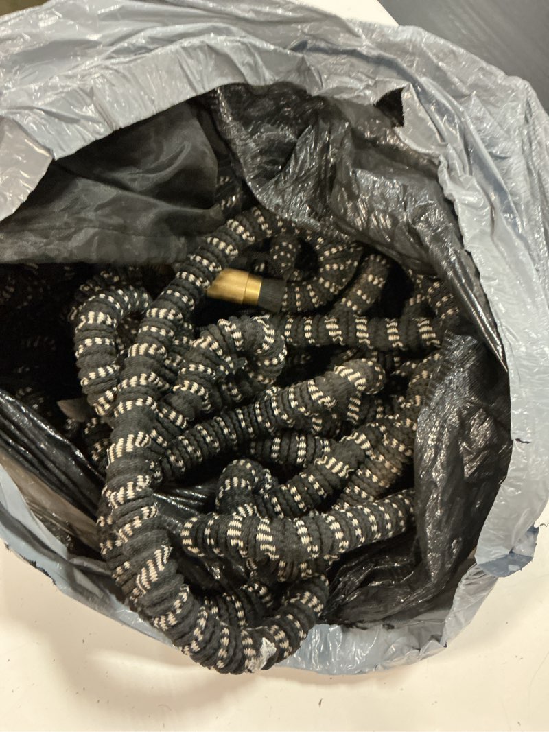 Condition photo showing As Is for 100ft expandable garden hose w/10 function spray nozzle, 2026 new superior strength water hoses, 3/4