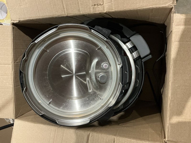 Condition photo showing As Is for instant pot pro 10-in-1 pressure cooker, slow cooker, rice/grain cooker, steamer, sauté, sous vide, yogurt maker, sterilizer, and warmer, includes app with over 800 recipes, black, 6 quart 6 quarts