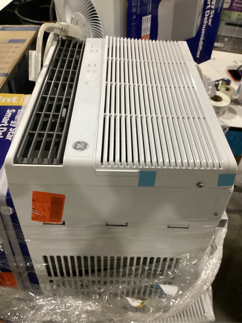 Condition photo showing As Is for 10,000btu 115-volts smart window air conditioner for 450 sq. ft. in white with wi-fi and remote
