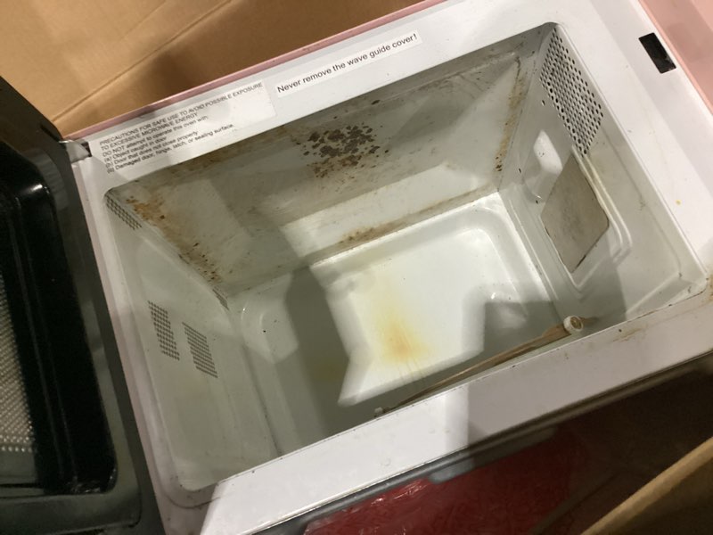 Condition photo showing As Is for microwave