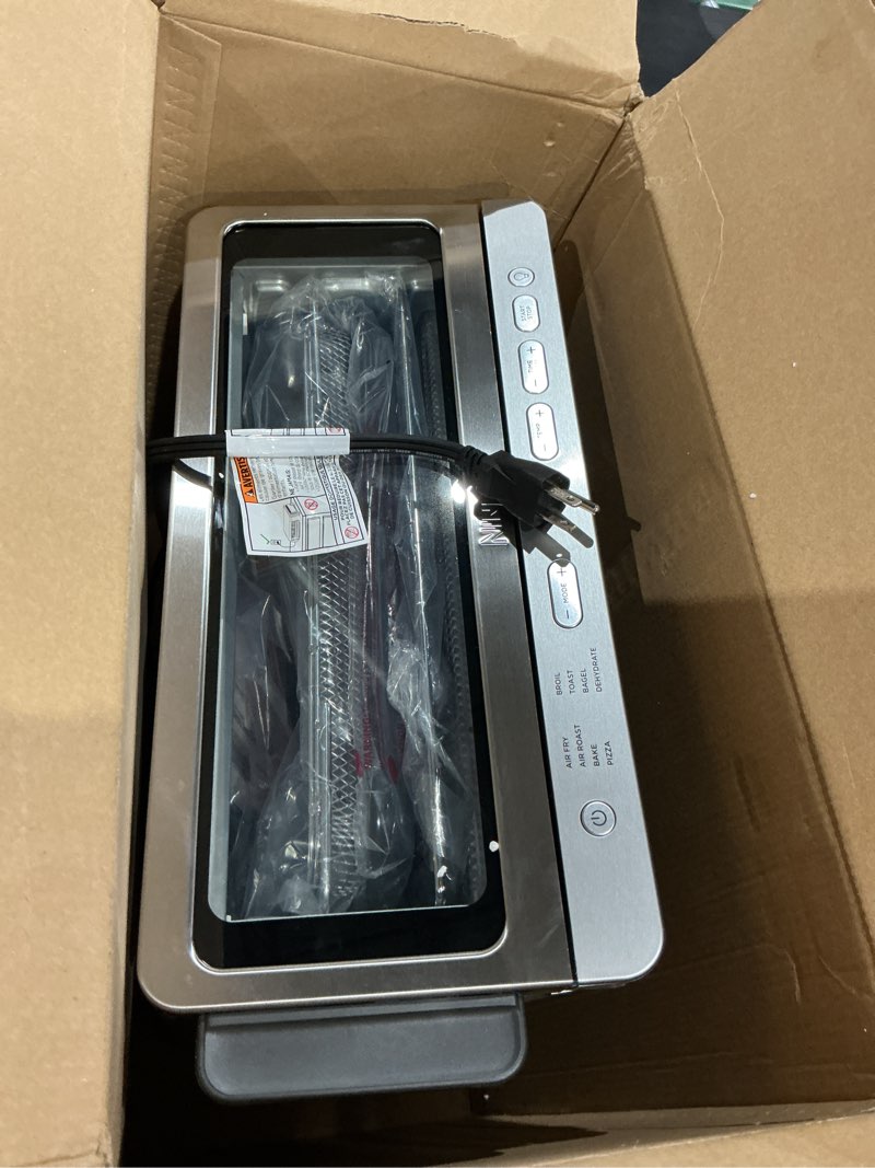 Condition photo showing Good Condition for ninja air fryer toaster oven combo | 8-in-1 functionality | flip up & away for storage space | air fry basket, sheet pan, wire rack & removable crumb tray |1800 watt | stainless steel | sp151 stainless premium 8-in-1 flip oven