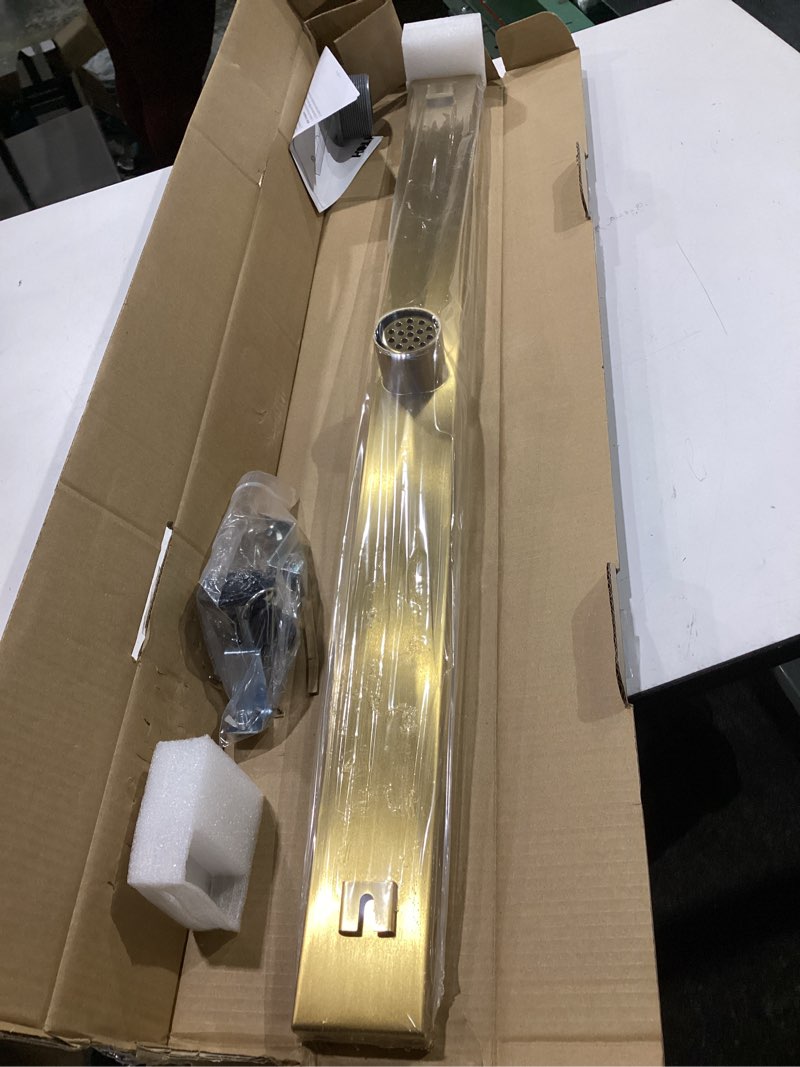 Condition photo showing New/Like New for gold shower drain, 36 inch linear shower drain with removable square hole cover grate, bathroom modern 304 stainless steel brushed gold shower floor drain with adjustable feet,hair strainer brushed gold 36in