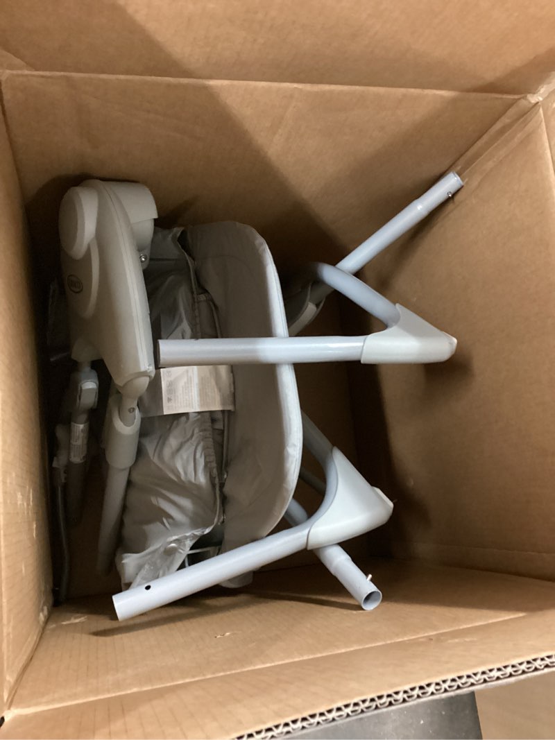 Condition photo showing As Is for graco slim spaces compact baby swing, space saving portable bay swing with height adjustable legs & soft toys, reign