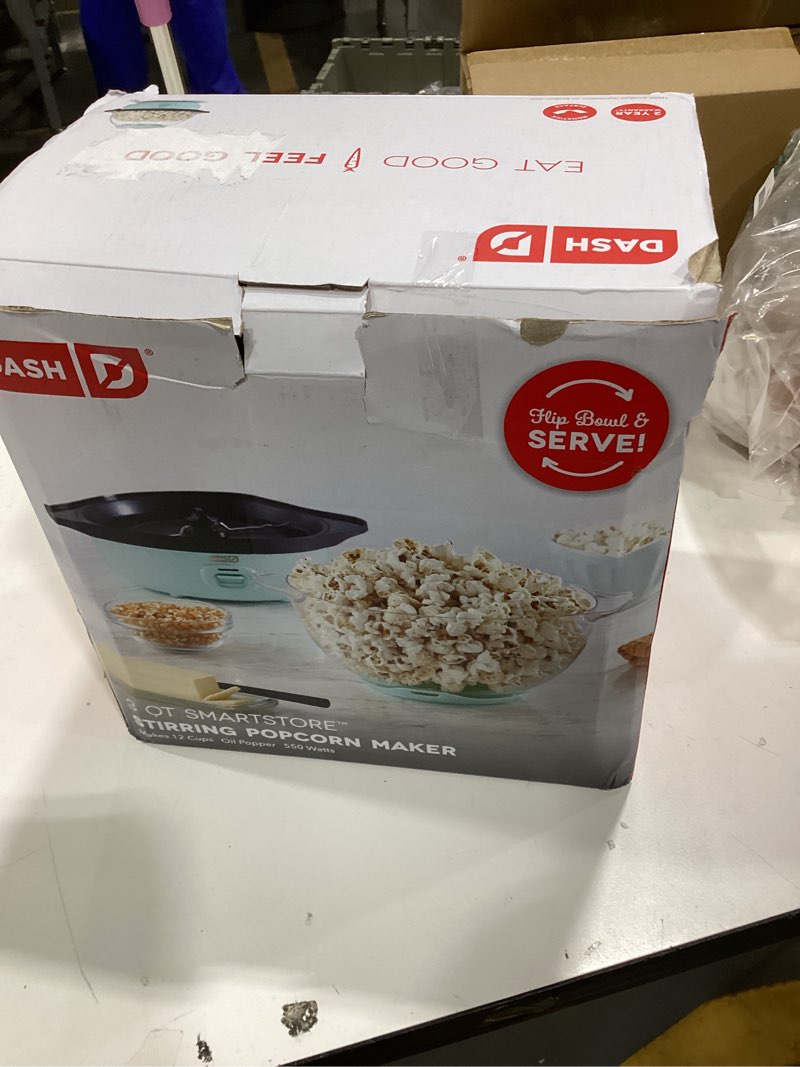 Condition photo showing As Is for dash smartstore deluxe stirring popcorn maker - hot oil electric popcorn popper with butter-warming tray, clear serving bowl, storage