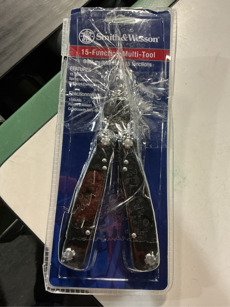 Condition photo showing Good Condition for with 15 different tools, this multitool can help out in any situation. for easy carrying options, this tool comes with a black polyester sheath and belt clip. 2cr13 stainless steel components, titanium coated 2cr13 stainless steel handles with black polyester sheath.