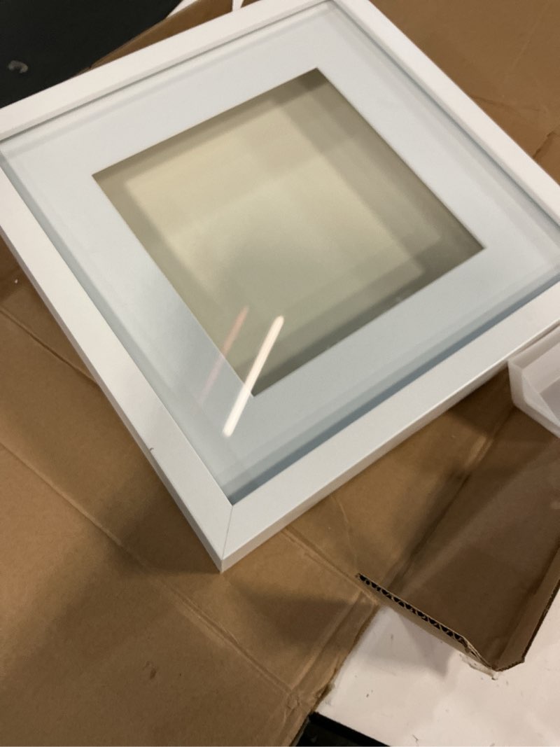 Condition photo showing Good Condition for Americanflat 12x12 Shadow Box Frame with Shatter-Resistant Glass - Use as 10x10 Frame with Mat or 12x12 Without Mat - Silhouette Collection - White with Soft Felt Back White 12x12