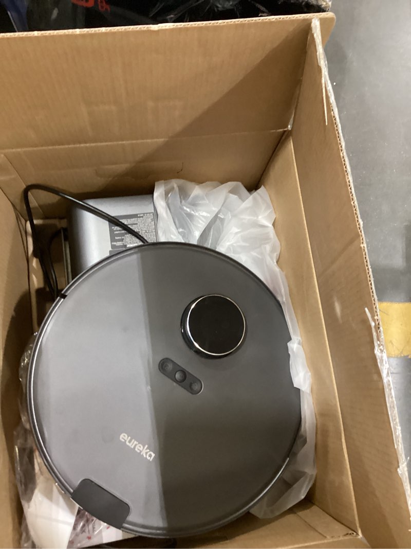 Condition photo showing As Is for eureka e20 robot vacuum with bagless self emptying station, robotic vacuum and mop combo, 45-day capacity, upgraded 8000pa suction and anti hair-tangling brush, lidar navigation, app control black e20