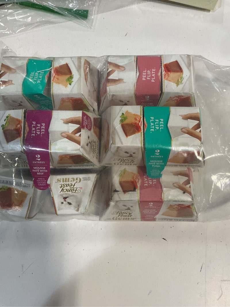 Condition photo showing New/Like New for best by 05/2027 fancy feast gems pate cat food mousse and a halo of savory gravy wet cat food variety pack - (pack of 12) 4 oz. boxes (missing 2 packs)