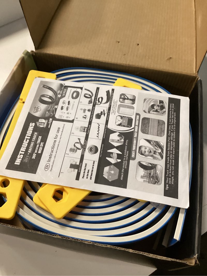 Condition photo showing New/Like New for 15 ft flexible race car track (daytona blue) for kids,flex track starter set compatible with hot wheels and diecast 1/64th cars,portable racetrack roll up race track with 4 racecars and suction cups
