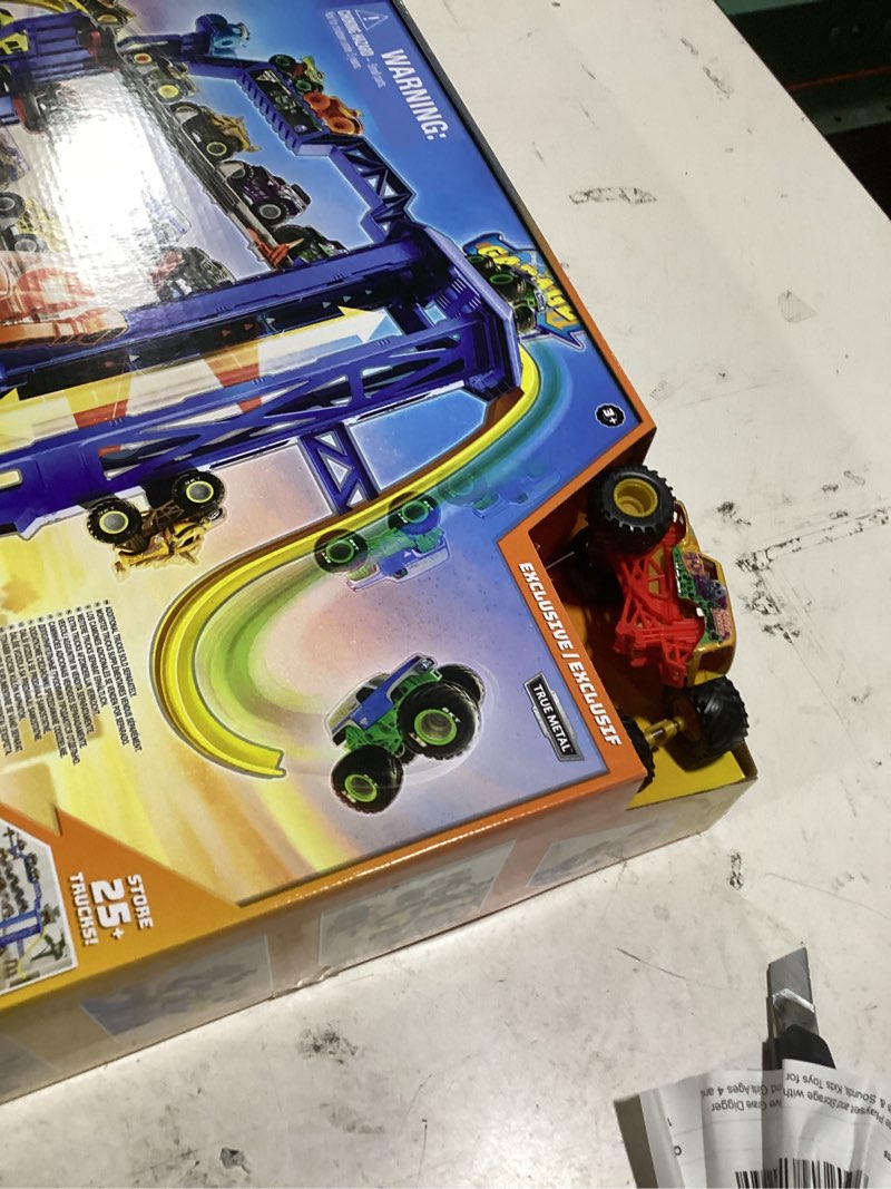 Condition photo showing As Is for monster jam garage playset and storage with exclusive grave digger monster truck, lights & sounds, kids toys for boys and girls ages 4 and up playset: garage