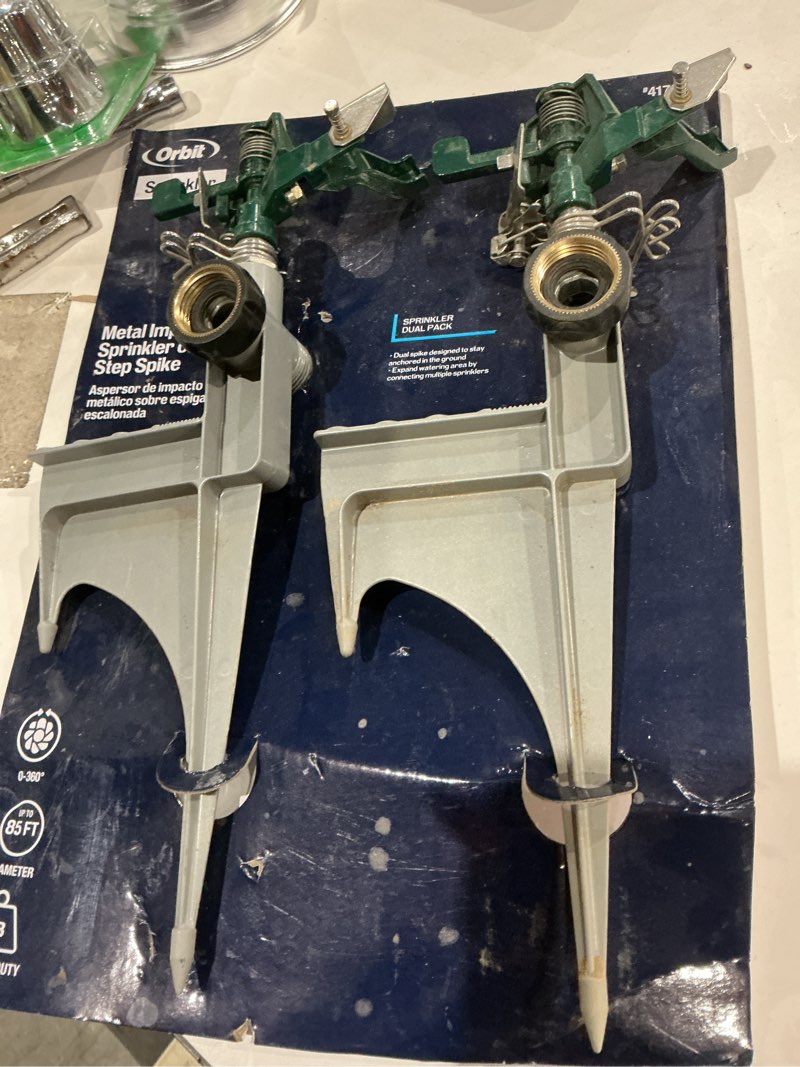Condition photo showing As Is for orbit 2-pack 6,500-sq ft impulse spike lawn sprinkler