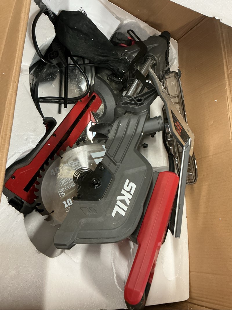 Condition photo showing As Is for skil 10-in 15-amp dual bevel sliding compound corded miter saw (charger not included)