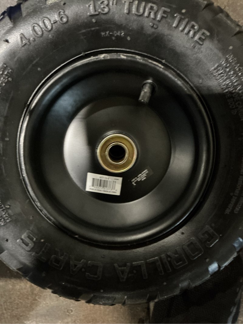 Condition photo showing As Is for 13 in. pneumatic replacement tire