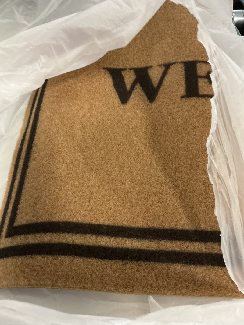 Condition photo showing As Is for olanly front door mat, low profile doormat, stain and fade resistant, easy to clean, for indoor and outdoor entrances, patio porch or entryway, brown (35x23 inch, welcome) brown welcome rectangular 35" x 23"