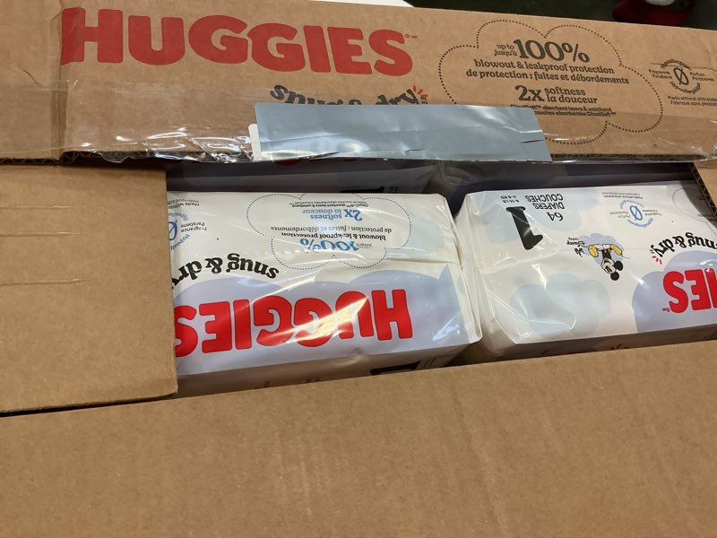 Condition photo showing New/Like New for Huggies Size 1 Diapers, Snug & Dry Newborn Diapers, Size 1 (8-14 lbs), 256 Count (4 Packs of 64), Packaging May Vary Size 1 256