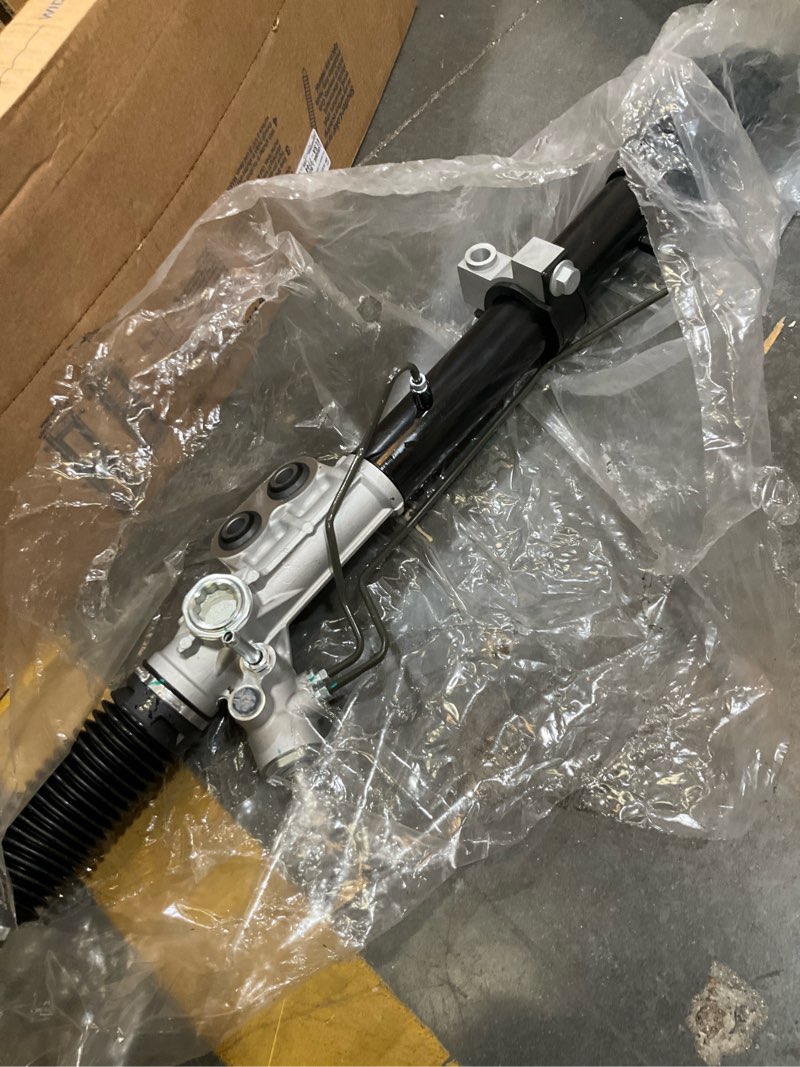 Condition photo showing As Is for hydraulic power steering rack and pinion assembly
