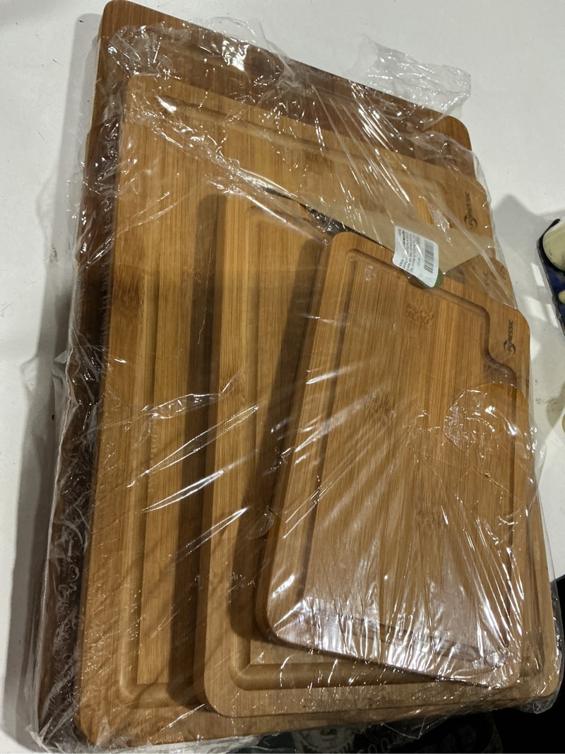Condition photo showing As Is for wood cutting board carbonized bamboo set with smooth surface set 4 packs with non slip feet holder and over sink solid thick durable wood charcuterie cheese serving tray kitchen gadgets (carbonized) set of 4?s+m+l+xl? brown