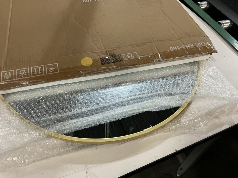 Condition photo showing Good Condition for gold 24 in w x 24 in. h round metal framed wall mirror