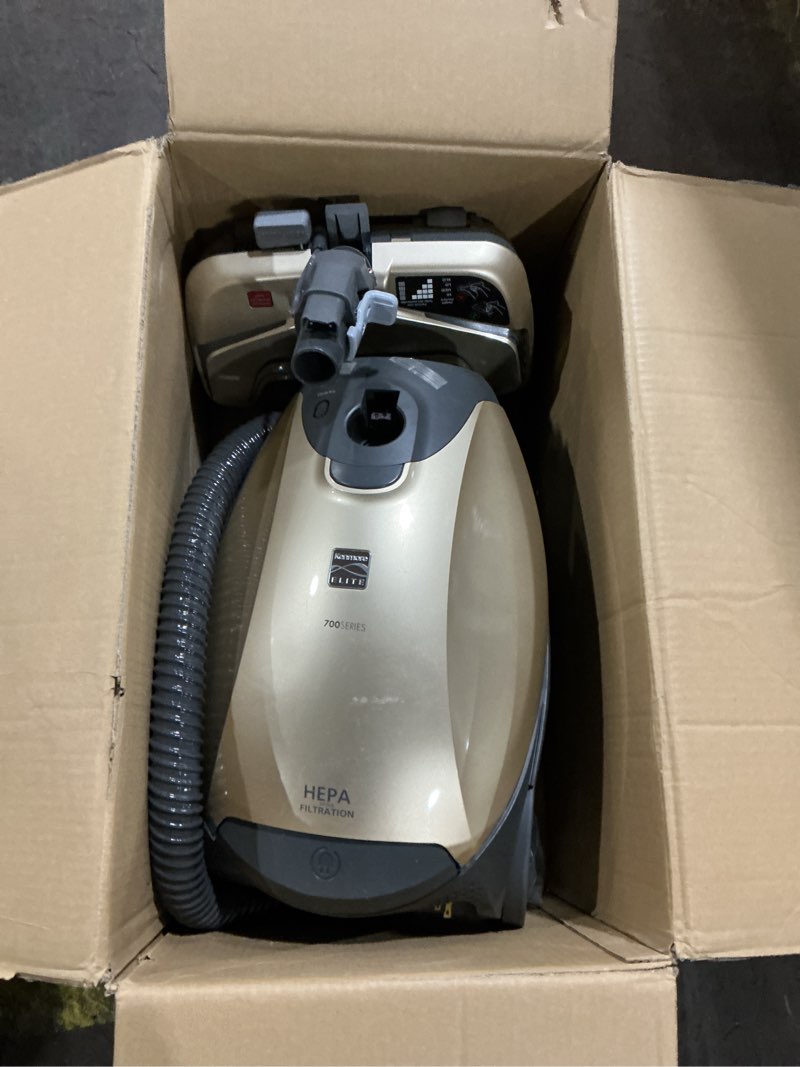 Condition photo showing As Is for kenmore elite 81714 pet friendly ultra plush lightweight bagged canister vacuum with pet powermate, hepa, extended telescoping wand, retractable cord, and 3 cleaning tools-champagne kenmore elite pet powermate + ultra plush capability