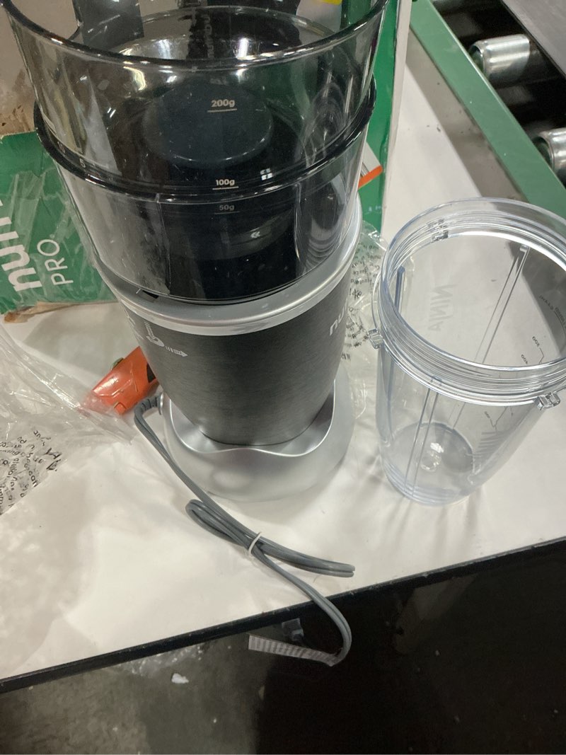 Condition photo showing As Is for NutriBullet Pro 900W Single-Serve Blender Exclusive Bundle (Black Stainless)
