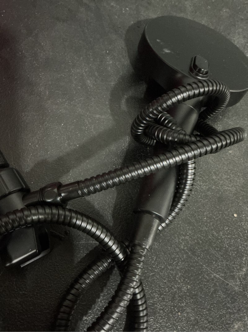 Condition photo showing As Is for 9 -spray matte black 5.9-in round filtered handheld shower head 