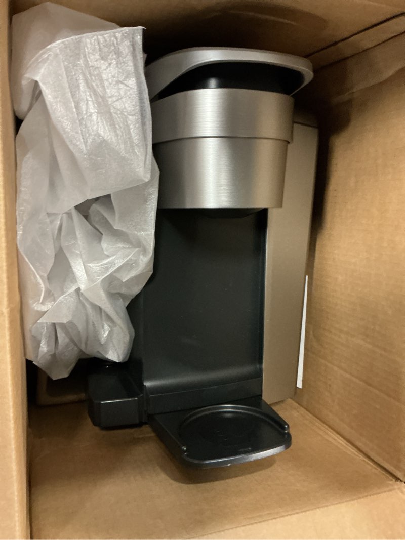 Condition photo showing As Is for keurig k-elite single serve k-cup pod coffee maker, with strength and temperature control, iced coffee capability, 8 to 12oz brew size, programmable, brushed silver