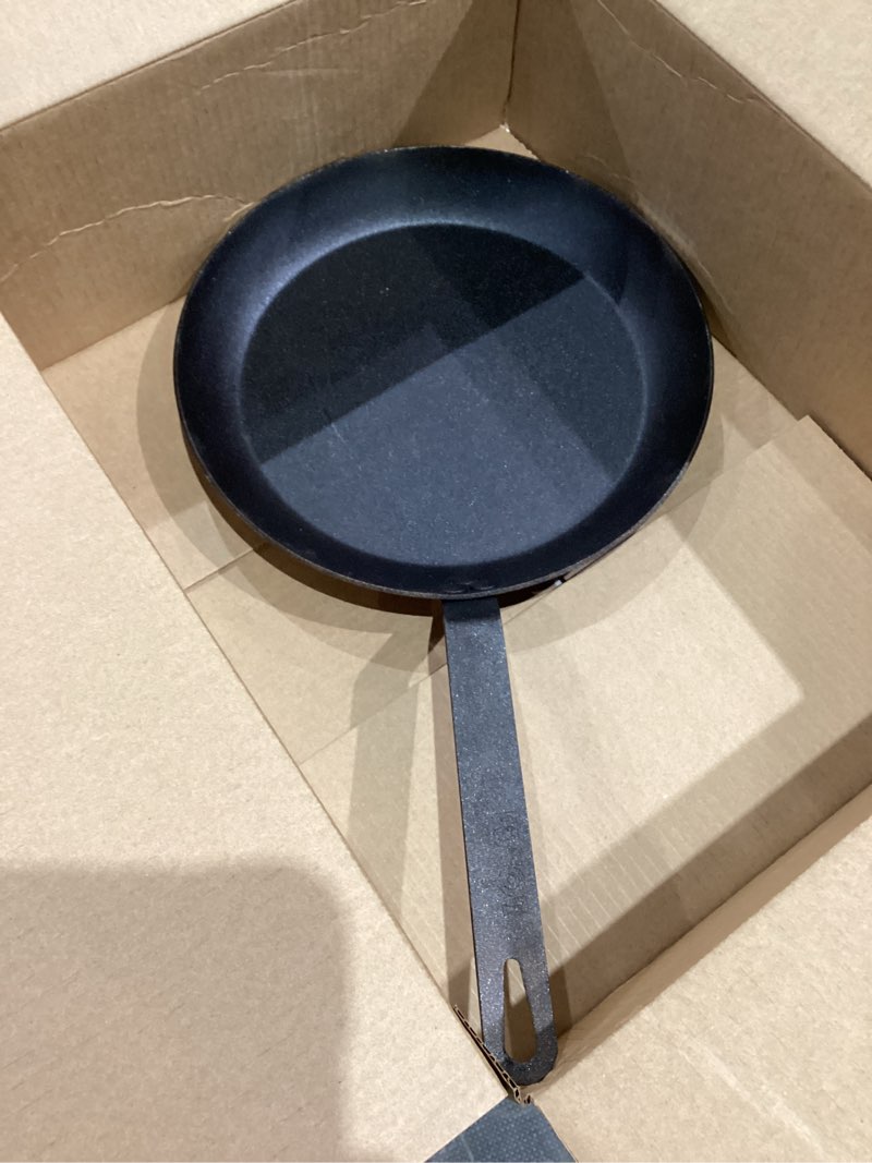 Condition photo showing As Is for Lodge Pre-Seasoned Carbon Steel Skillet - Use in the Oven, on the Stove, on the Grill, or Over a Campfire - 12 Inch