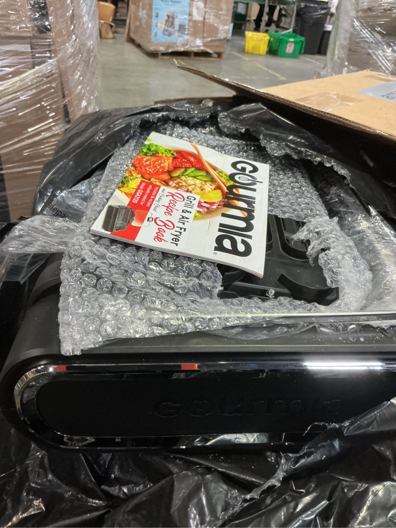 Condition photo showing As Is for gourmia smokeless indoor grill - air fryer combo with smoke extractor, 5 cooking presets, grill, air fry, roast, bake, dehydrate, countertop cooker, glass lid(espejo quebrado)