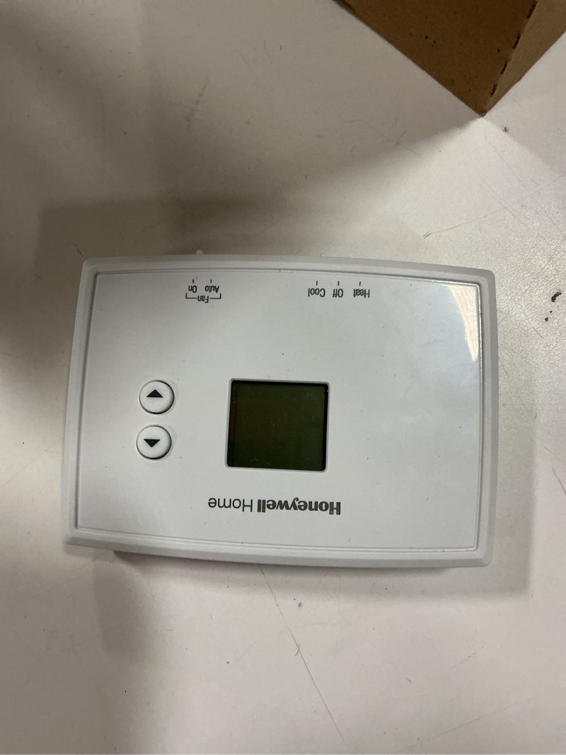 Condition photo showing As Is for today Honeywell Home 24-Volt Electronic Non-Programmable Thermostat Single-Stage Heating 