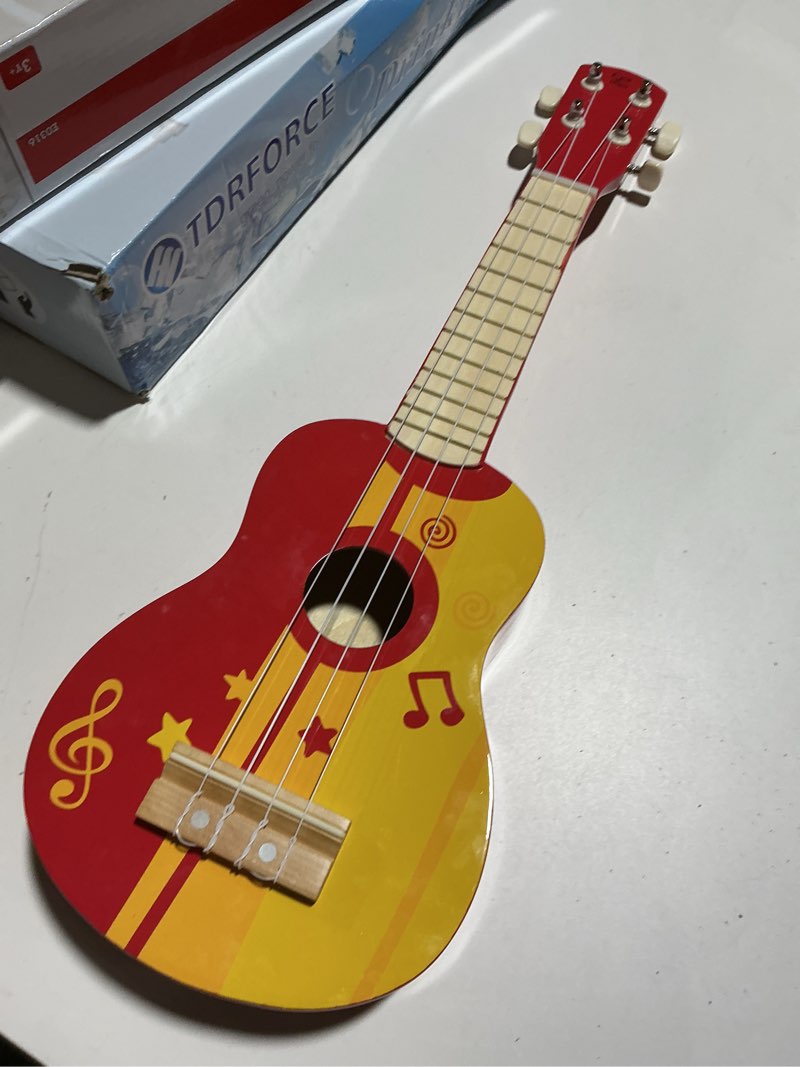Condition photo showing As Is for Hape Kid's Wooden Toy Ukulele, Red