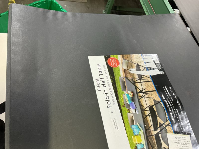 Condition photo showing As Is for mainstays 6 foot bi-fold plastic folding table, black
