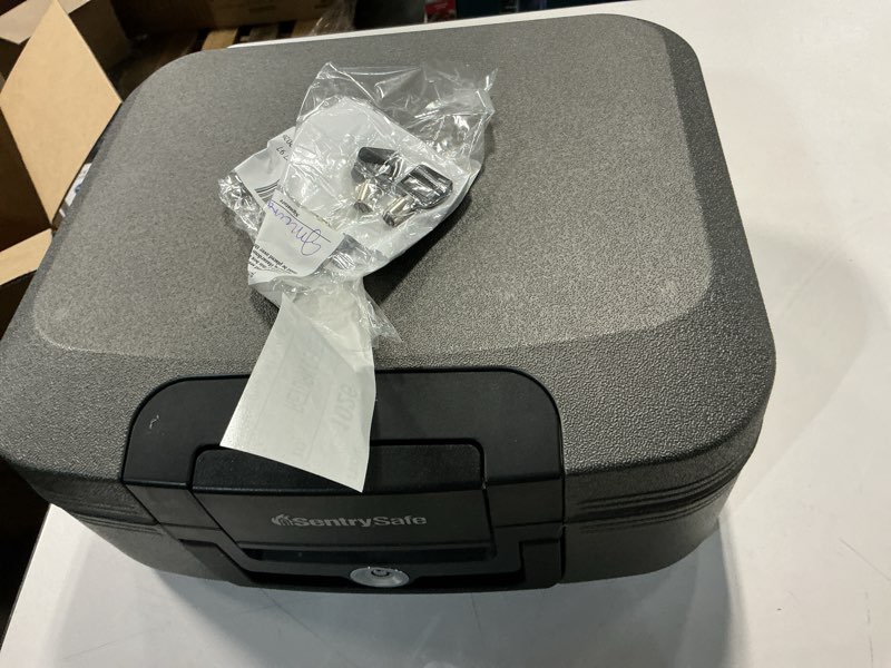 Condition photo showing As Is for sentrysafe chw30100 fire-resistant and water-resistant safe box with key lock, 0.36 cu