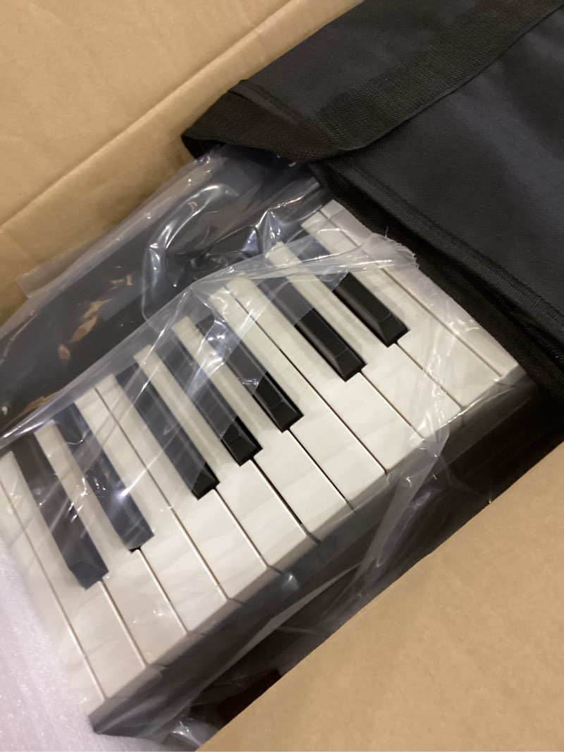 Condition photo showing As Is for KONIX Foldable Piano Keyboard, 88 Key Full Size Semi Weighted Folding Piano Keyboard, Bluetooth Portable Electronic Keyboard Piano with Sheet Music Stand, Sustain Pedal and Piano Bag, Black