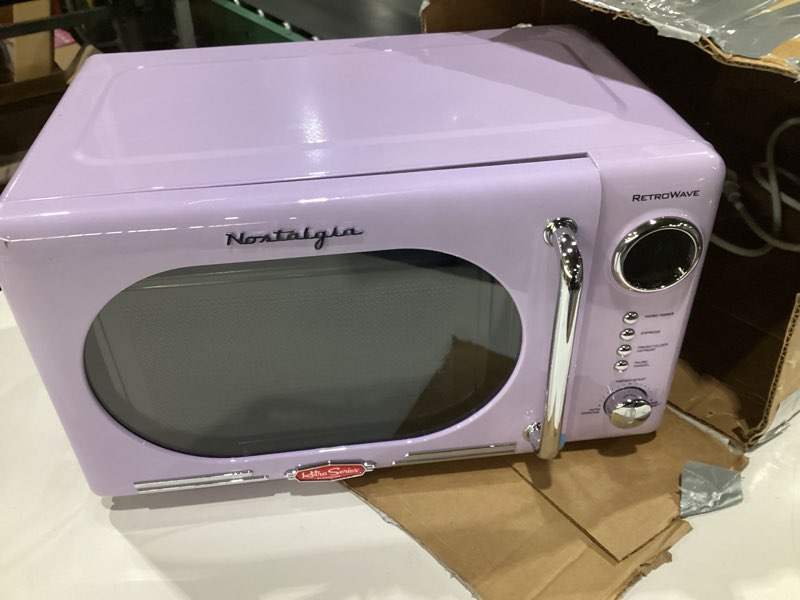 Condition photo showing As Is for (USED, NOT TESTED, DOOR WONT SHUT) Nostalgia Retro Compact Countertop Microwave Oven - 0.7 Cu. Ft. - 700-Watts with LED Digital Display - Child Lock - Easy Clean Interior - Lavender Retro Classic 0.7 Cu. Ft. Lavender