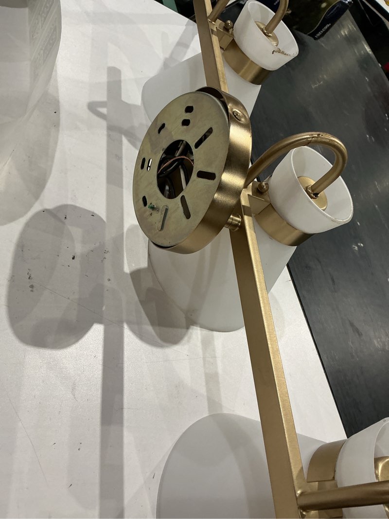 Condition photo showing As Is for origin 21 zadie 24-inches 3 -light brushed champagne mid-century vanity light